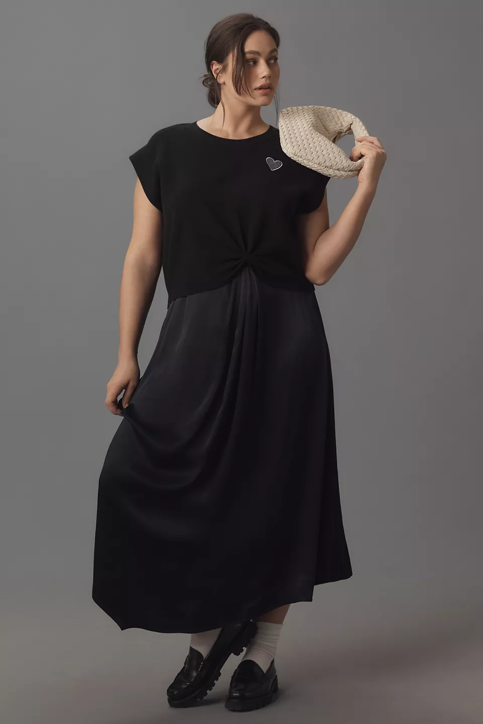 A plus-size black slip dress with a short-sleeve, black, heart-decal sweater
