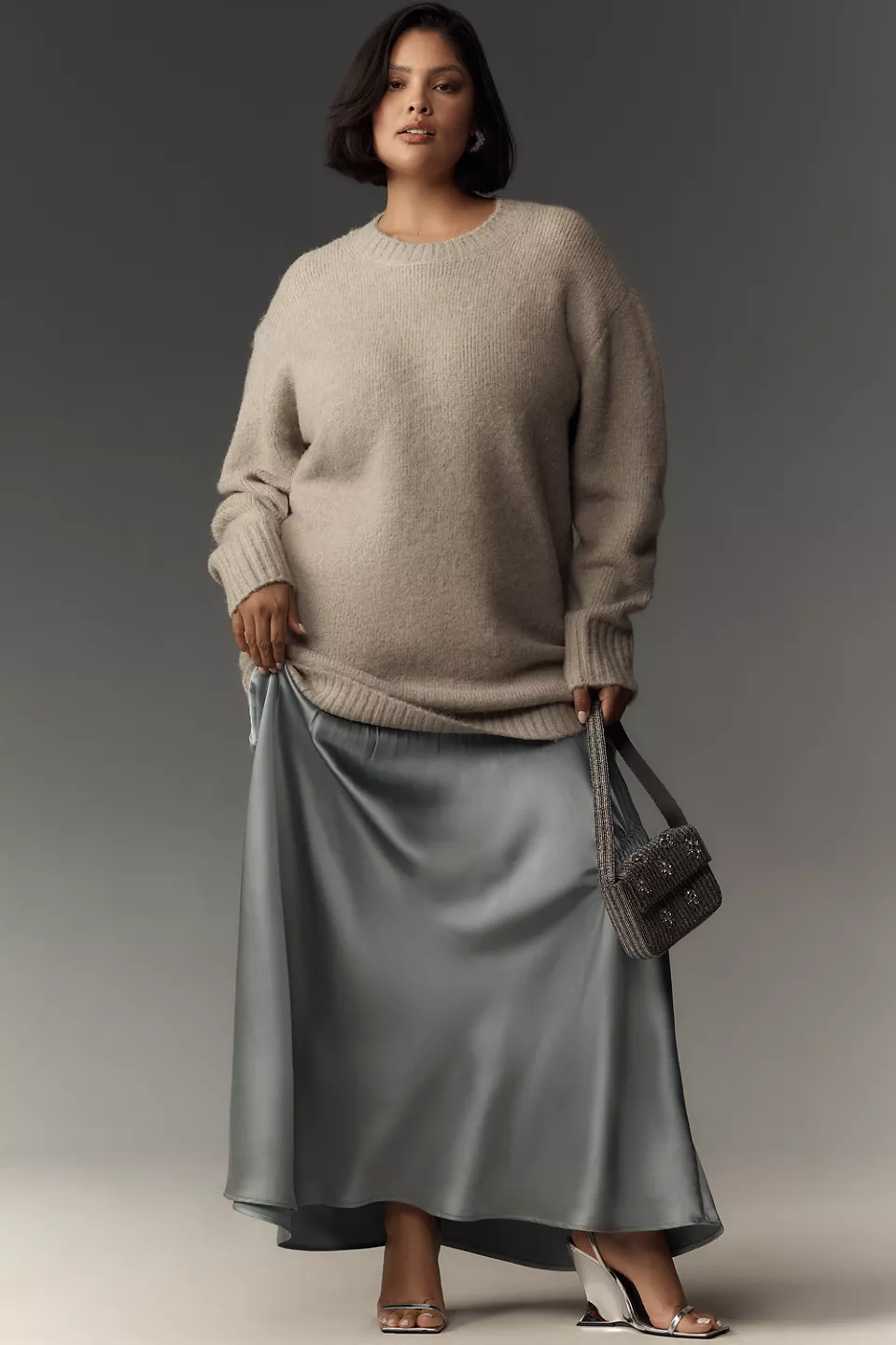 A plus-size gray twofer dress with a sweater top and slip skirt
