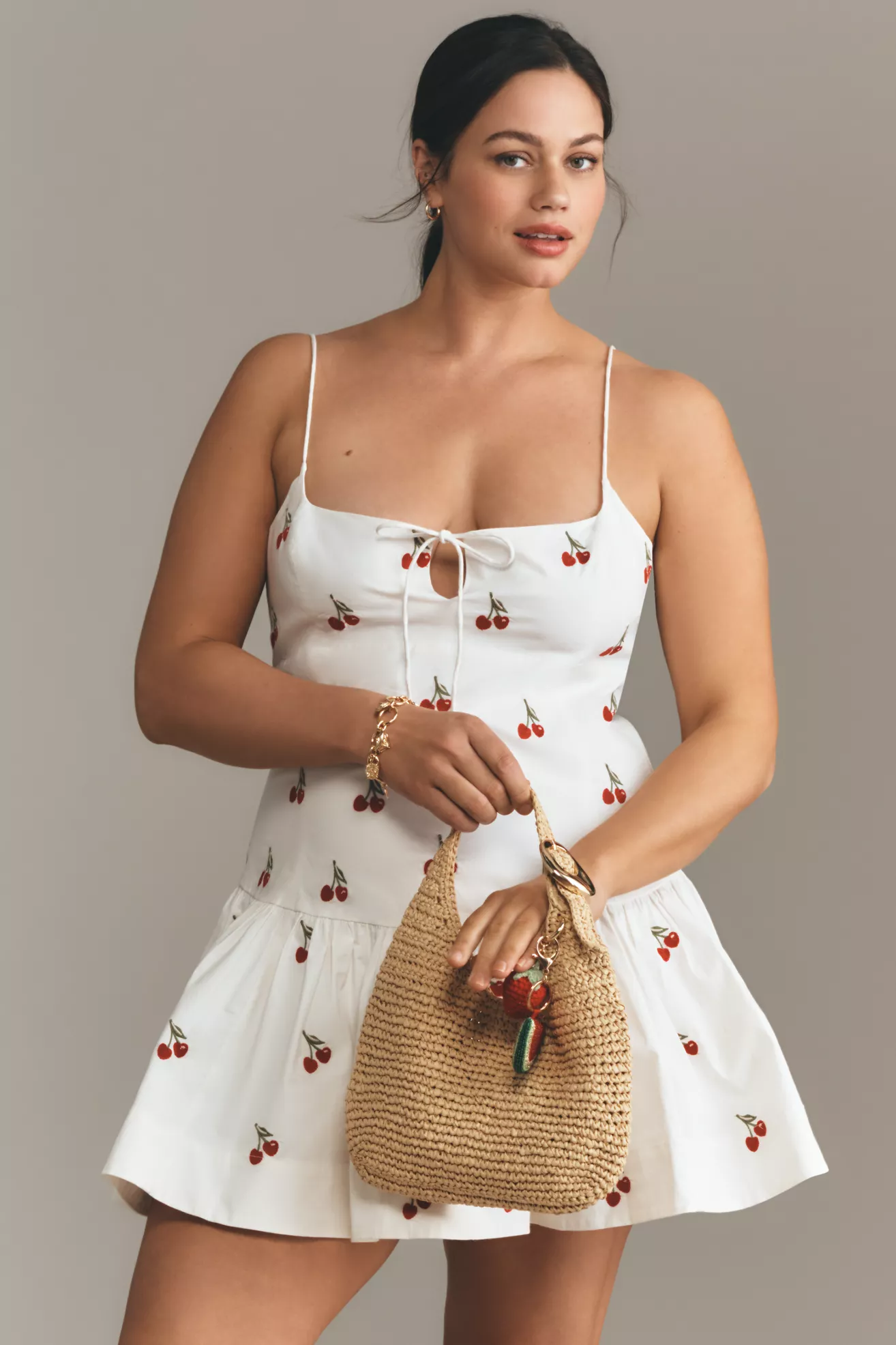 A plus-size, white, cherry-print mini dress
