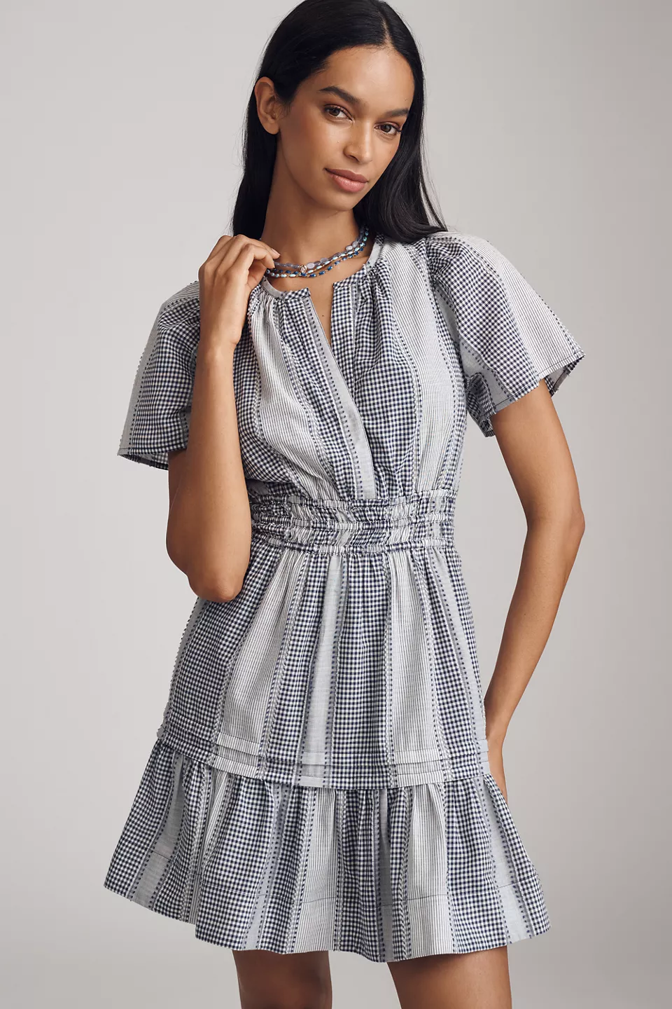 A blue-and-white gingham mini dress