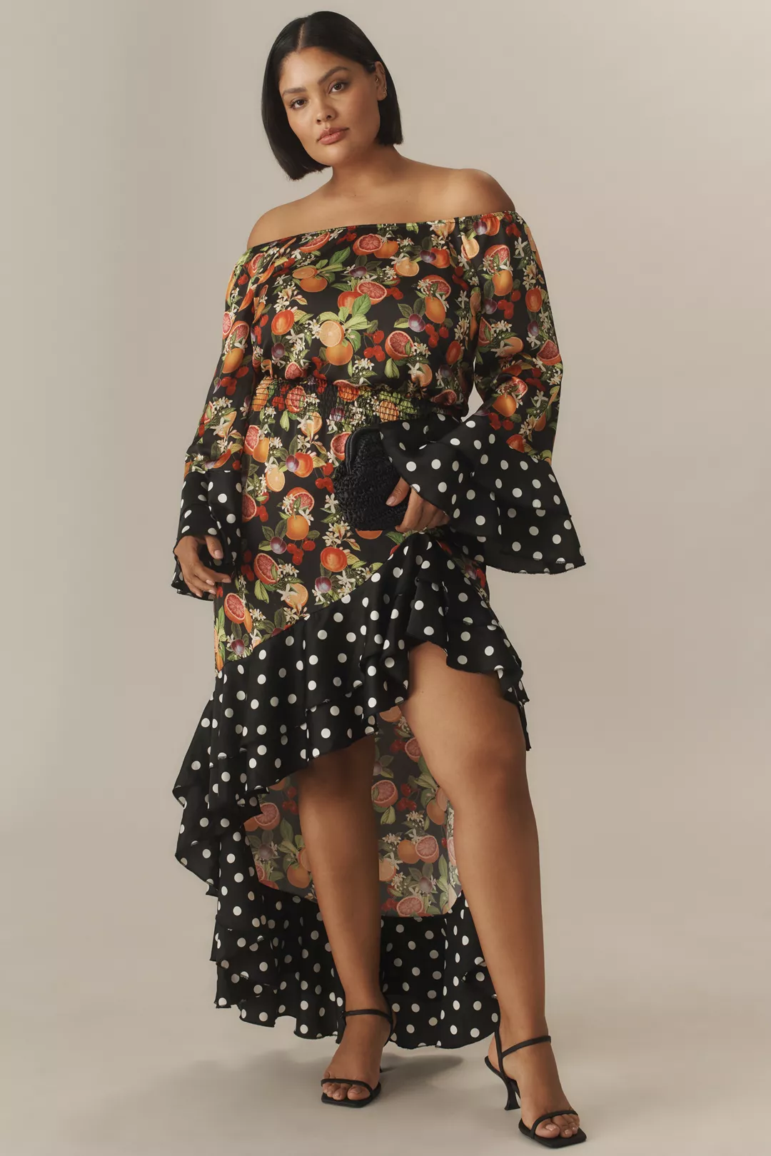 A plus-size, off-the-shoulder, fruit-print dress with polka-dot trim