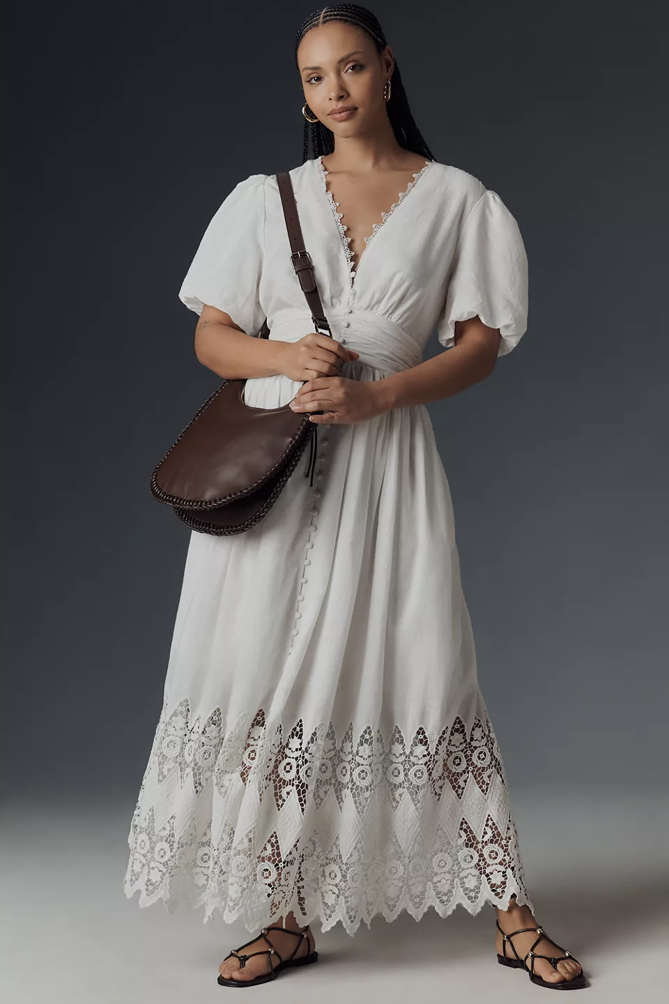 A plus-size, puff-sleeve, white eyelet midi dress