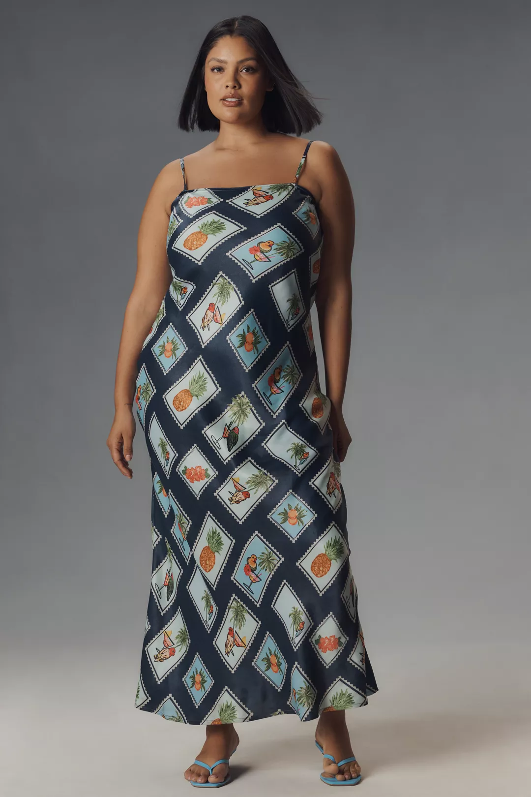A plus-size, pineapple- and drink-print slip dress
