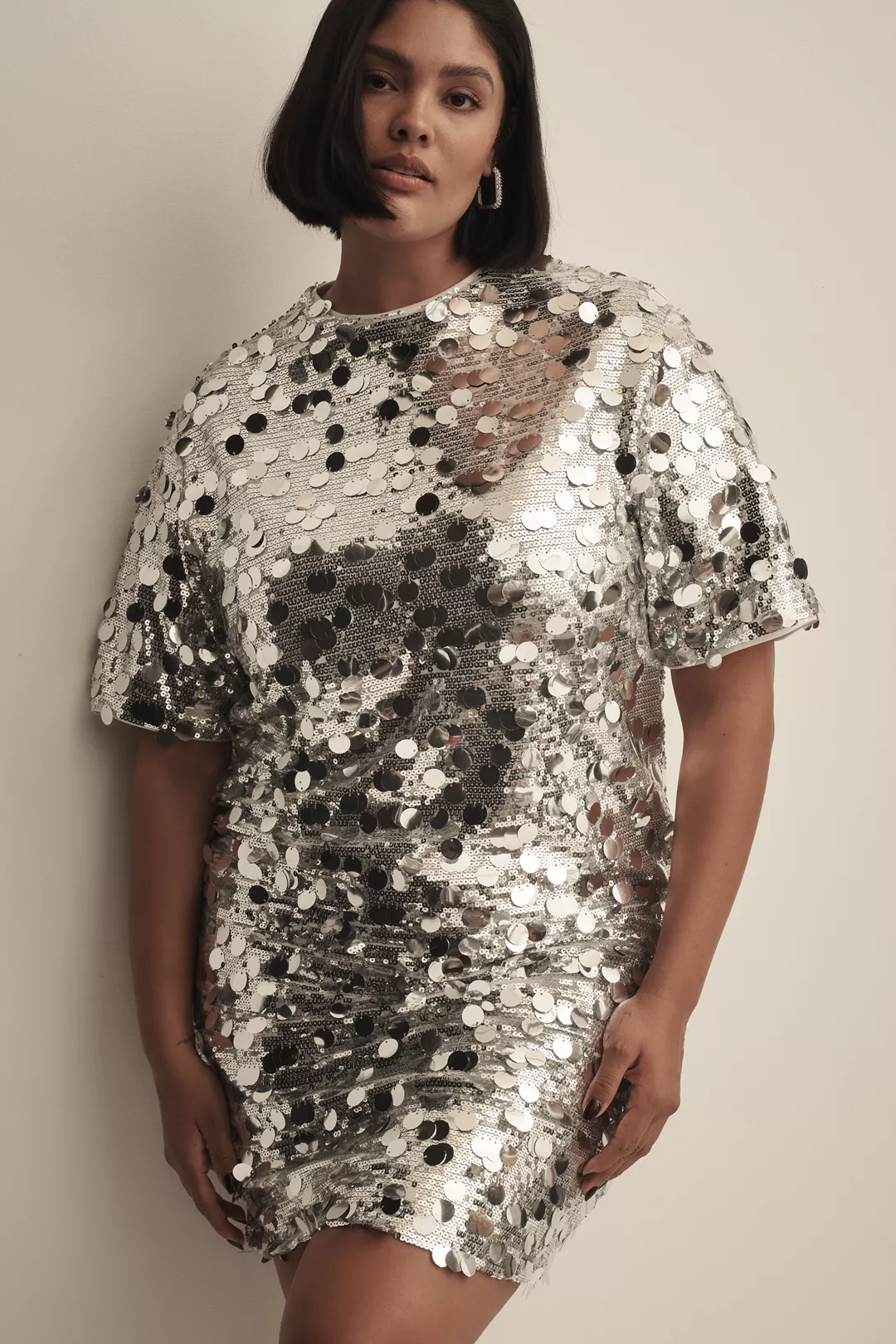 A plus-size, silver paillette sequin T-shirt dress