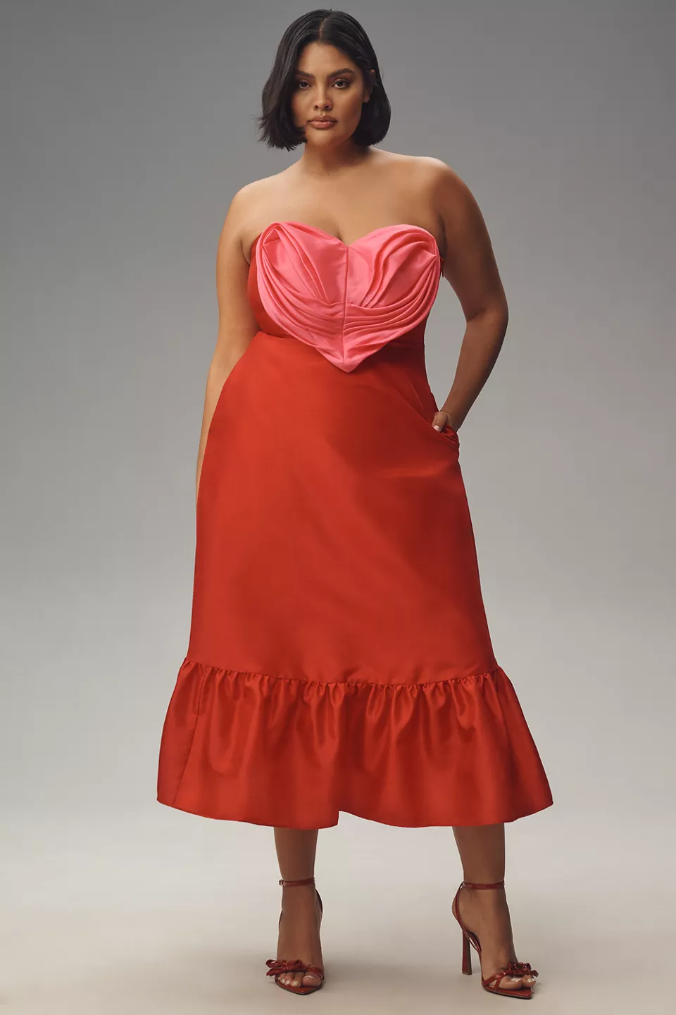 A plus-size red dress with a textured pink heart bodice