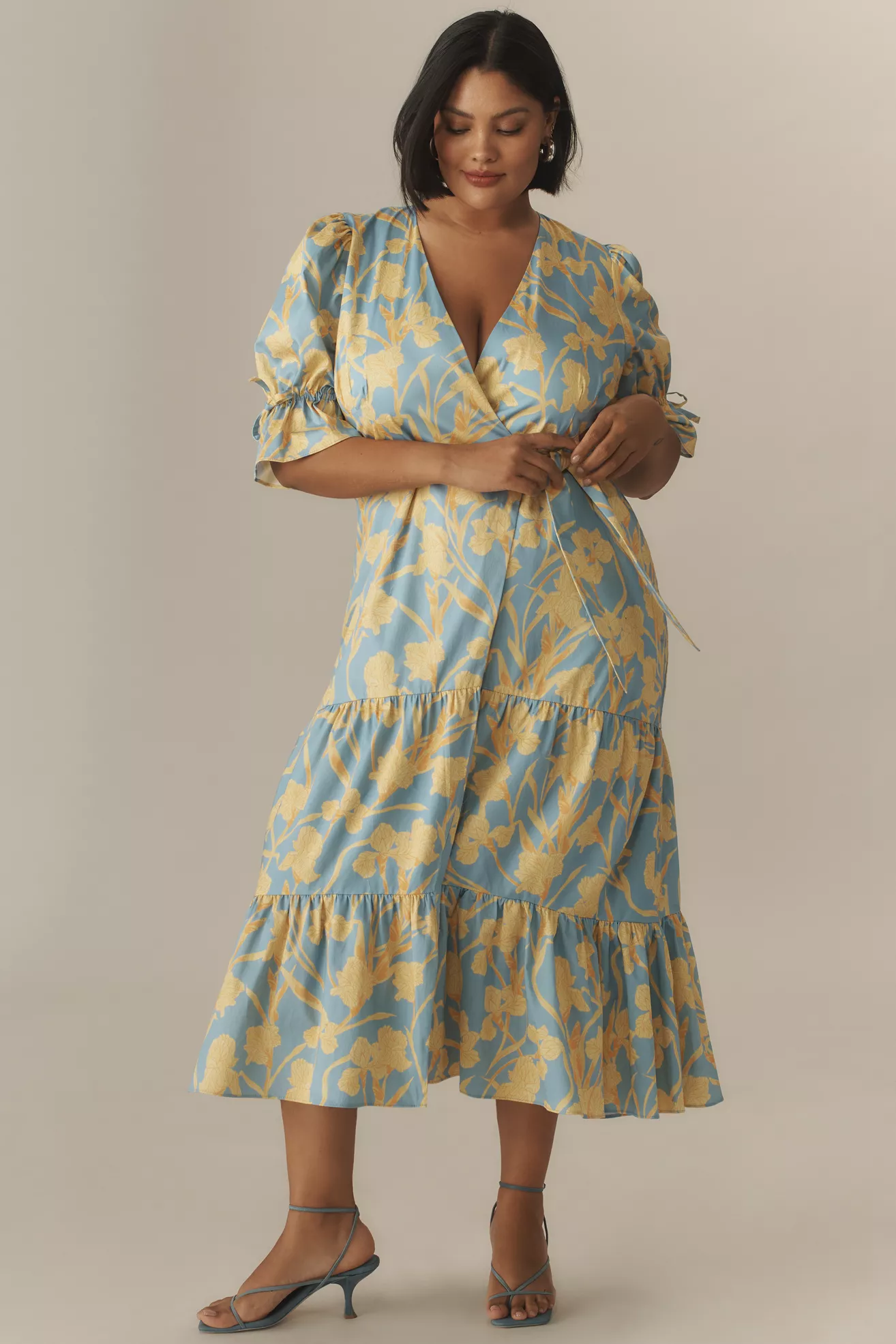 A plus-size, blue and yellow floral, wrap dress