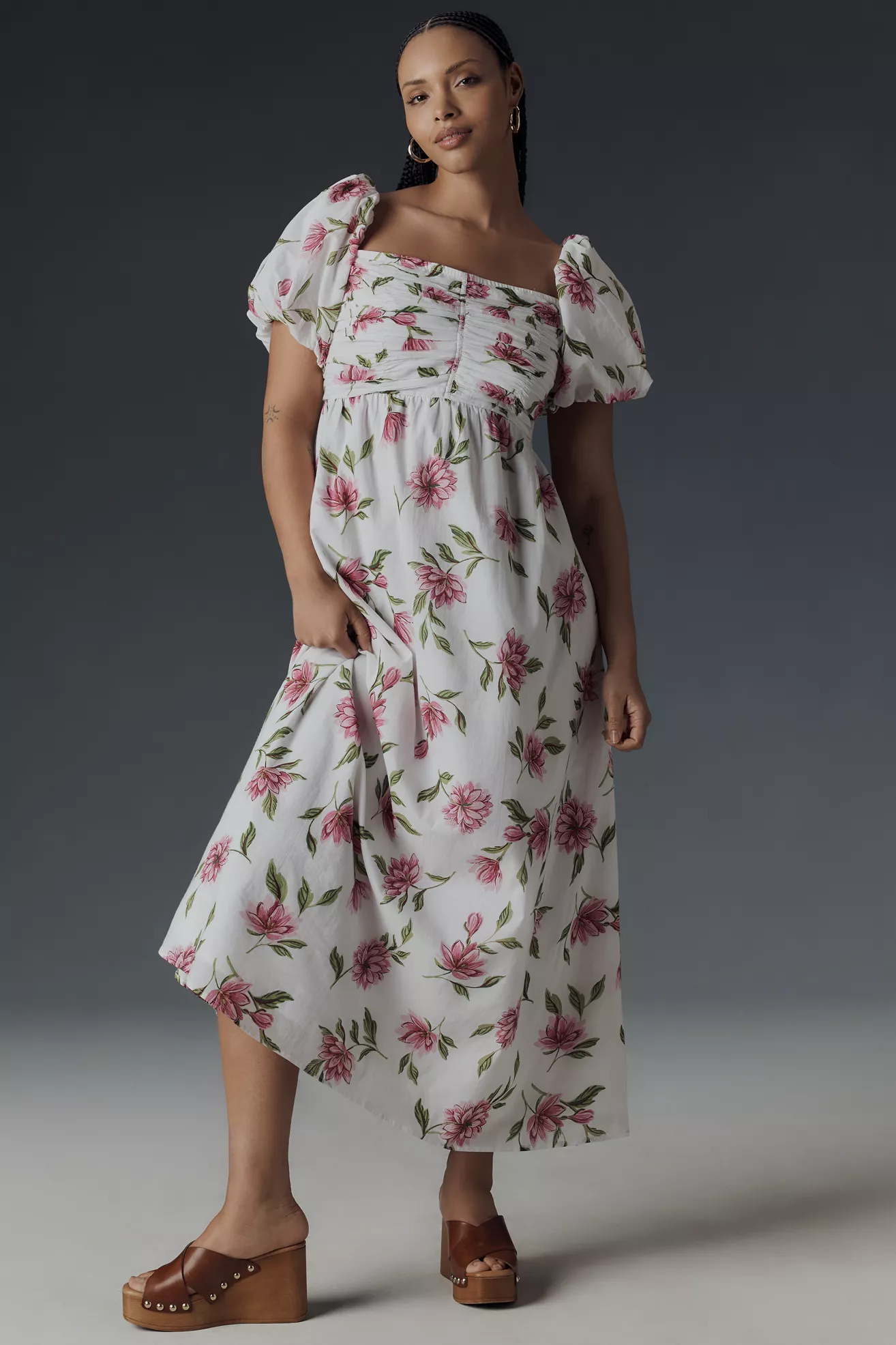 A plus-size, white and pink floral, puff-sleeve, babydoll maxi dress
