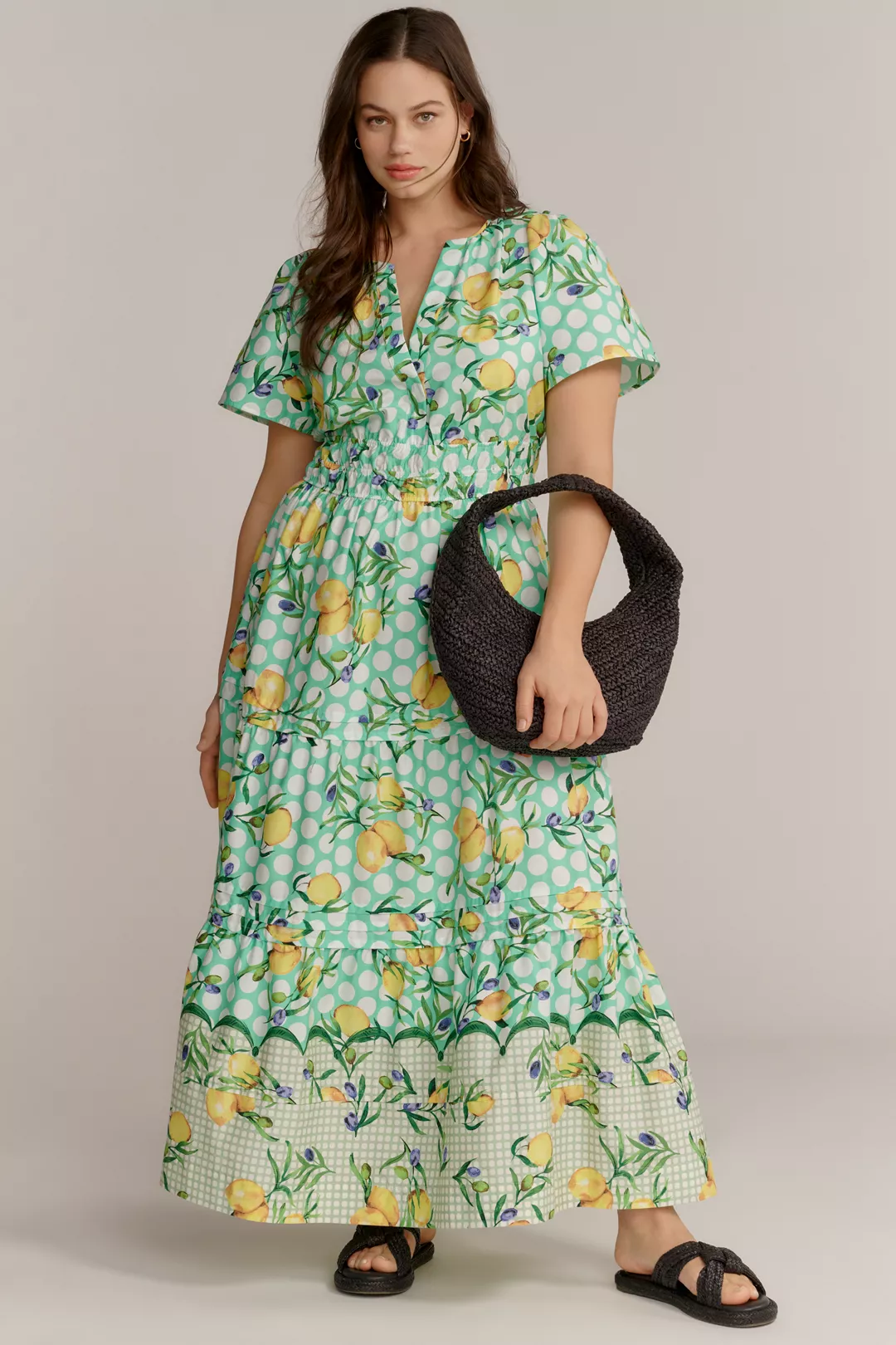 A plus-size green polka-dot, lemon-print maxi dress