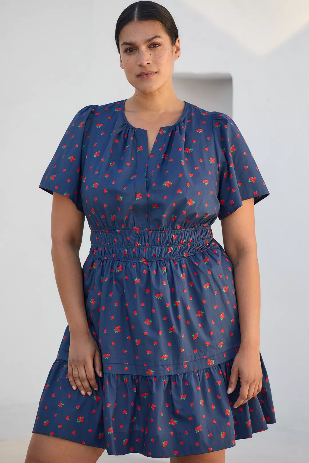 A plus-size, strawberry-print mini dress