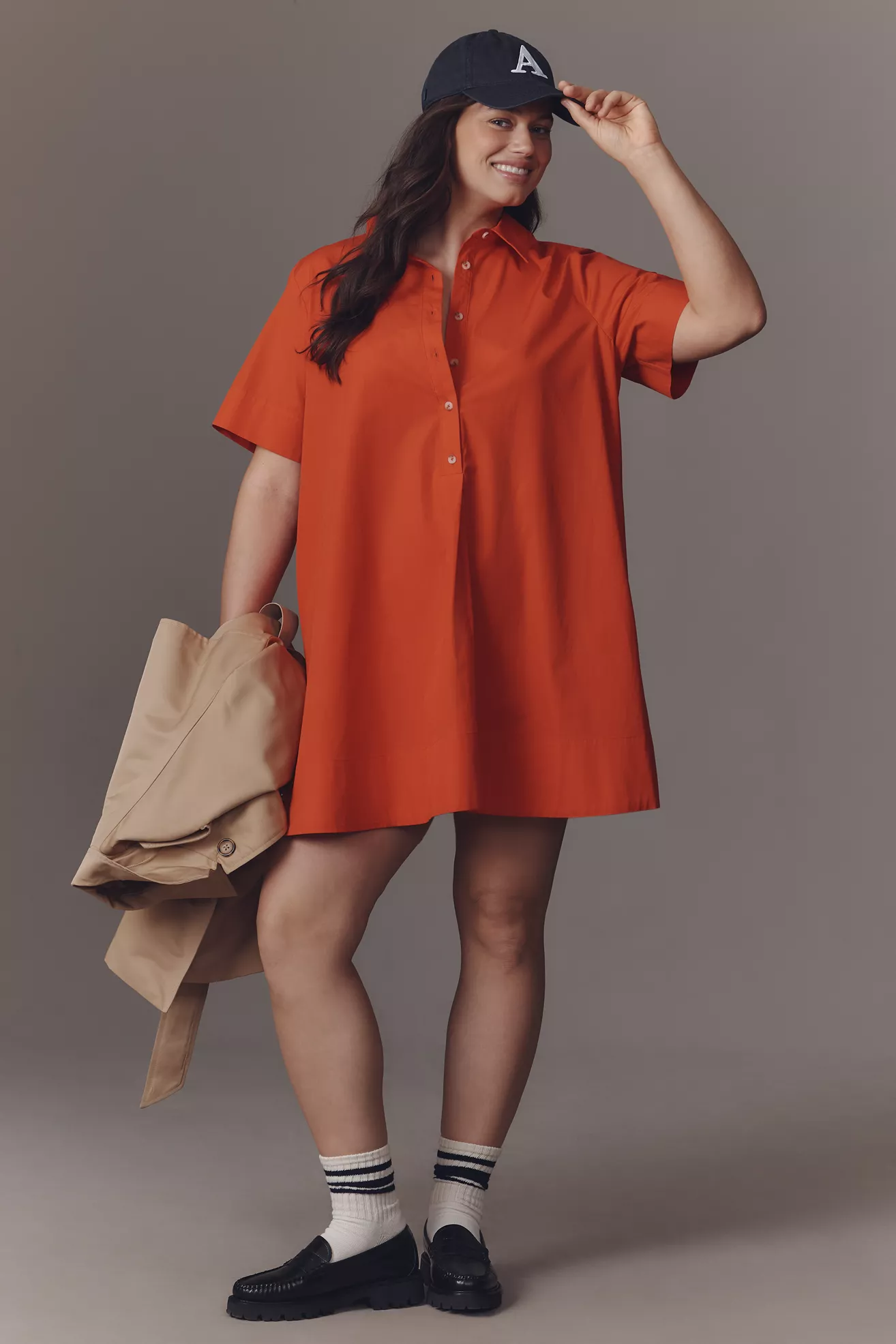 A plus-size, red, button-up, mini shirt dress