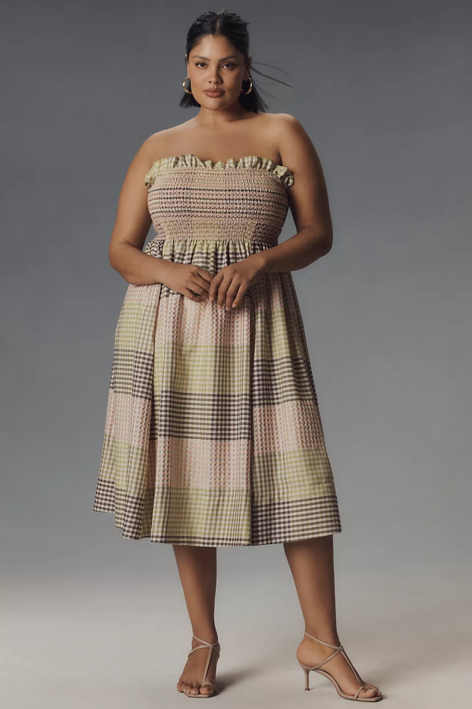 A plus-size, strapless, multicolor gingham midi dress