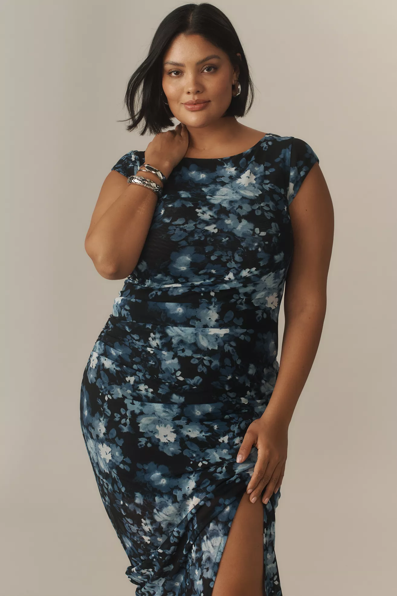 A plus-size, blue and black floral, midi dress