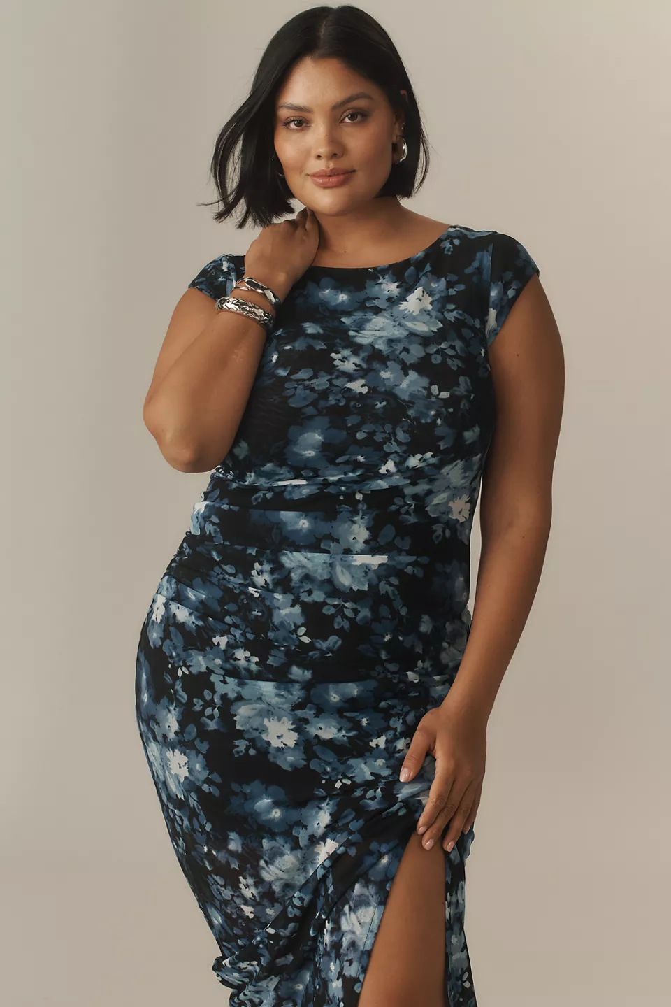 A plus-size, black-and-blue, floral fitted dress