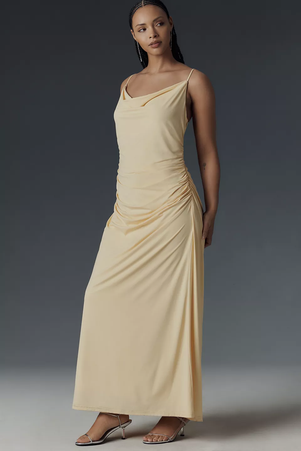 A drapey plus-size pale-yellow slip dress