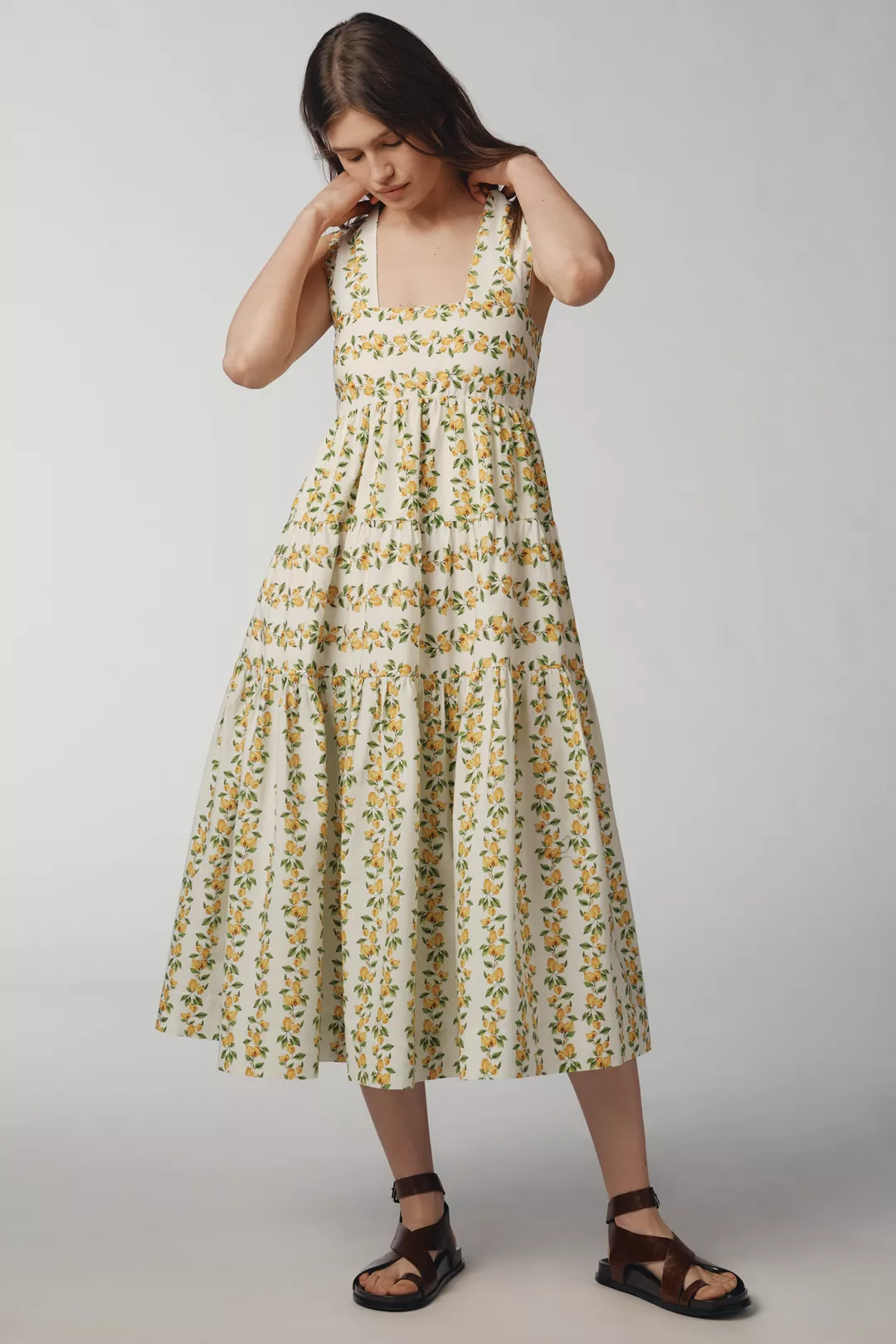 A white, lemon-print midi dress