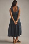 the helena square-neck tiered midi dress: smocked denim edition By Anthropologie The Helena Square-Neck Tiered Midi Dress: Smocked Denim  Edition at MarketFair Shoppes in Princeton, NJ