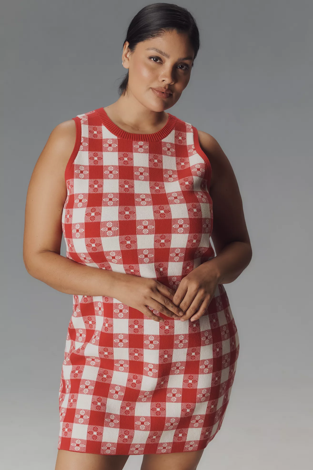 A plus-size, red-and-white gingham, knit mini dress