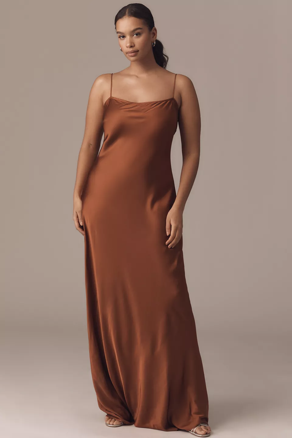 A plus-size brown maxi slip dress