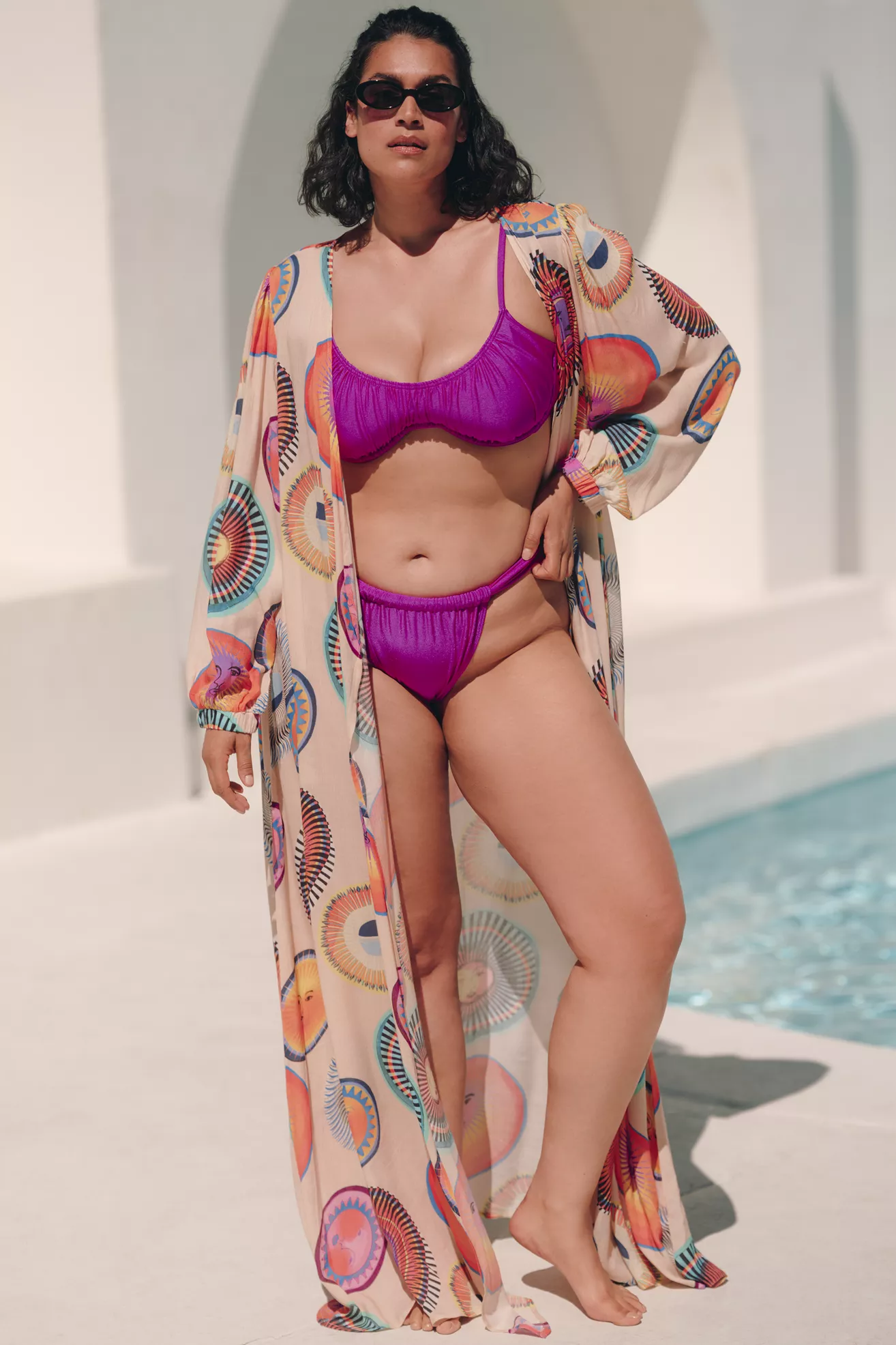 A plus-size, printed, long-sleeve, maxi swim cover-up shawl