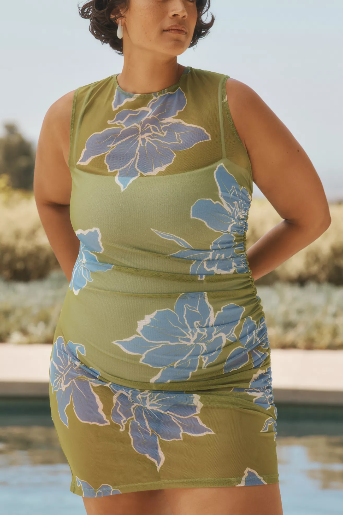 A plus-size, green and blue, tropical printed mini dress swim cover-up