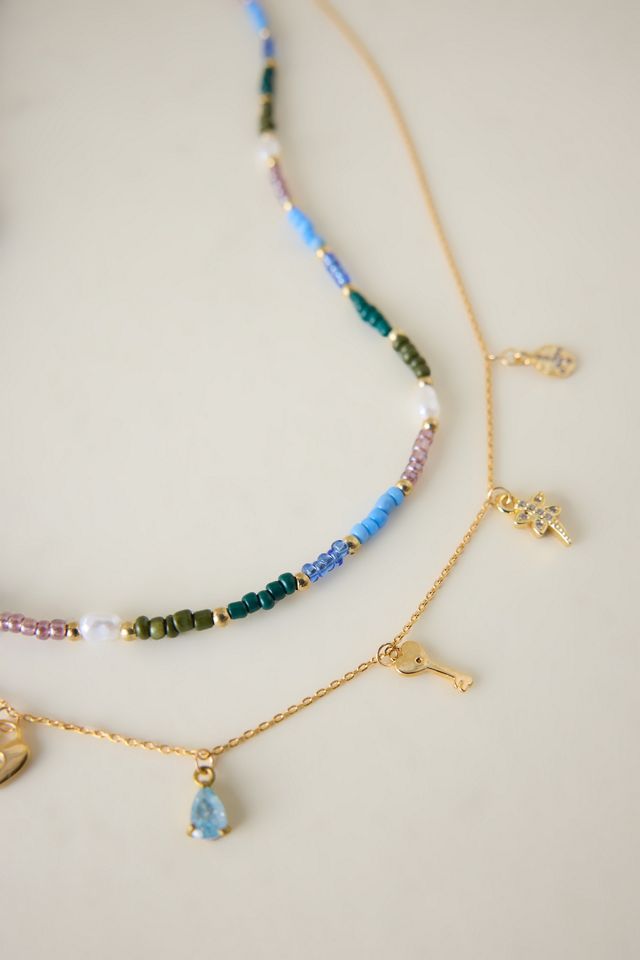 Collana a strat  i con ciondolo di perline #1