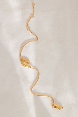 Bracelet plaqué or avec petit pendentif pièce à motif du zodiaque Rachel Jackson