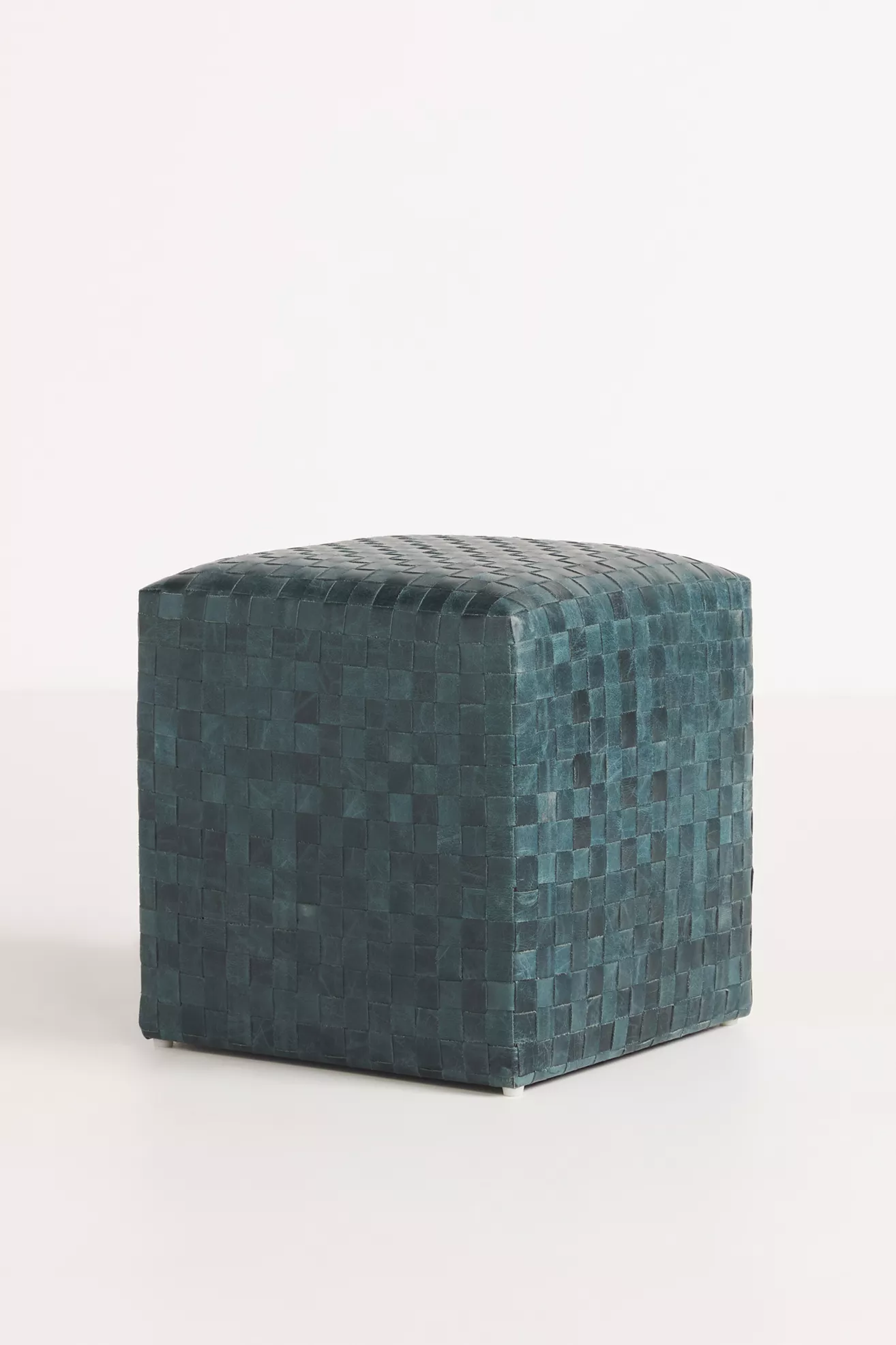 Teal woven leather ottoman from a slightly angled perspective