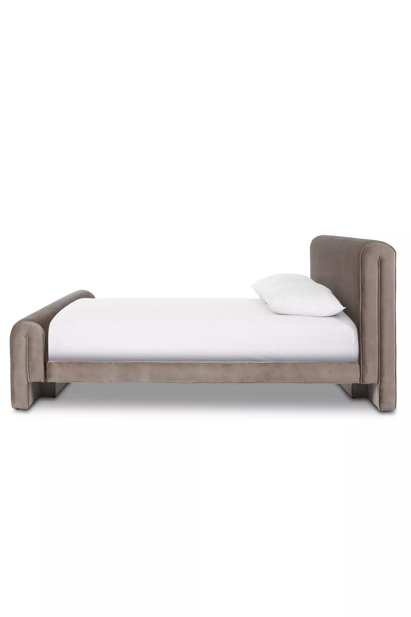 Side view of a taupe velvet bed showing headboard and armless side rails