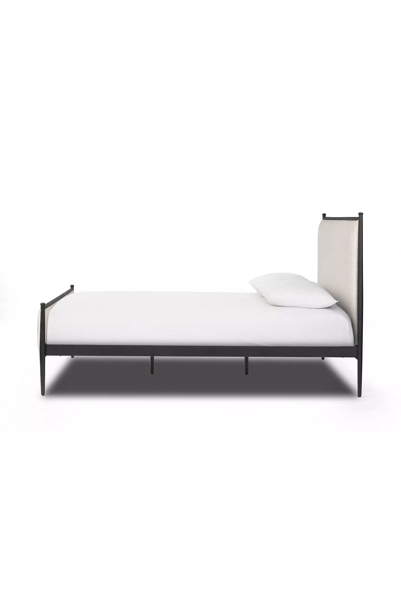 Side view of a bed from the foot side showing leg supports