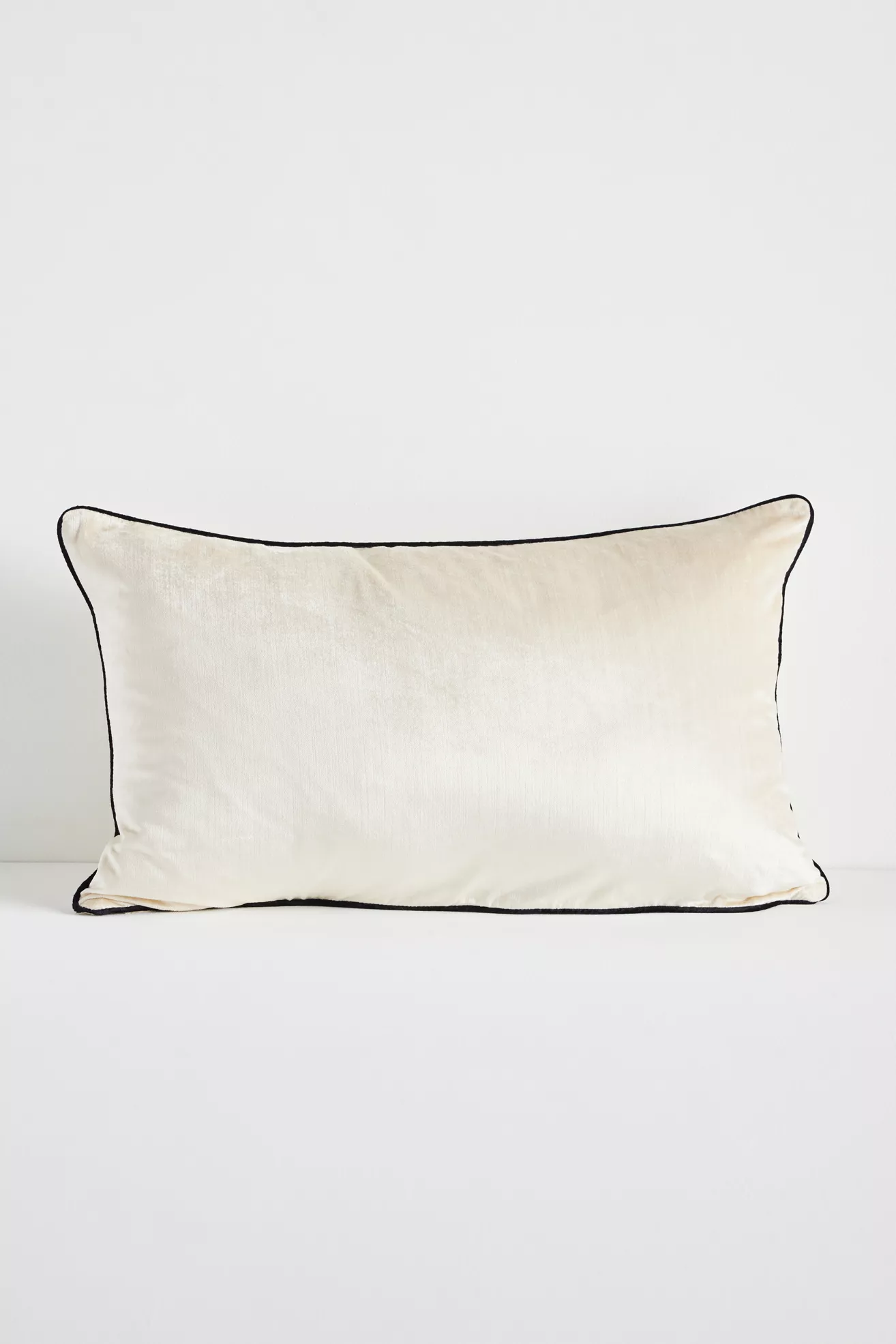 Cream velvet rectangular pillow with black piping