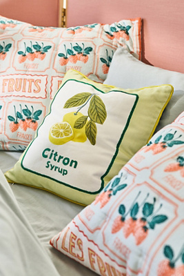 Collection of fruity decorative pillows in complementary colors and mixed textures