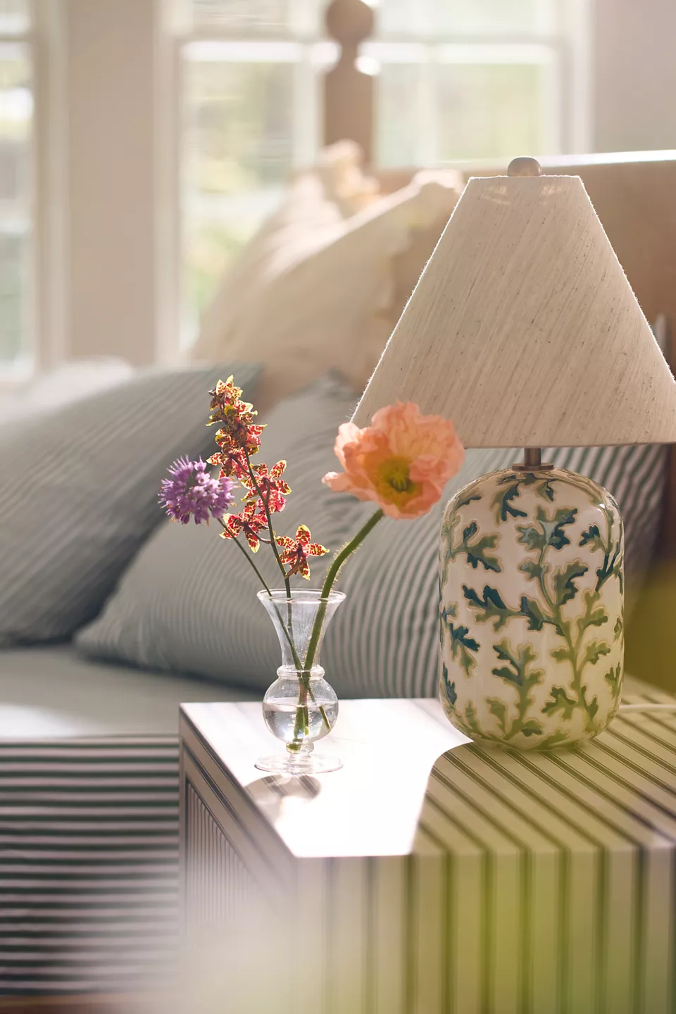 Anthrohome Claire Clear Glass Bud Vase in a small round bubble shape styled on a white shelf