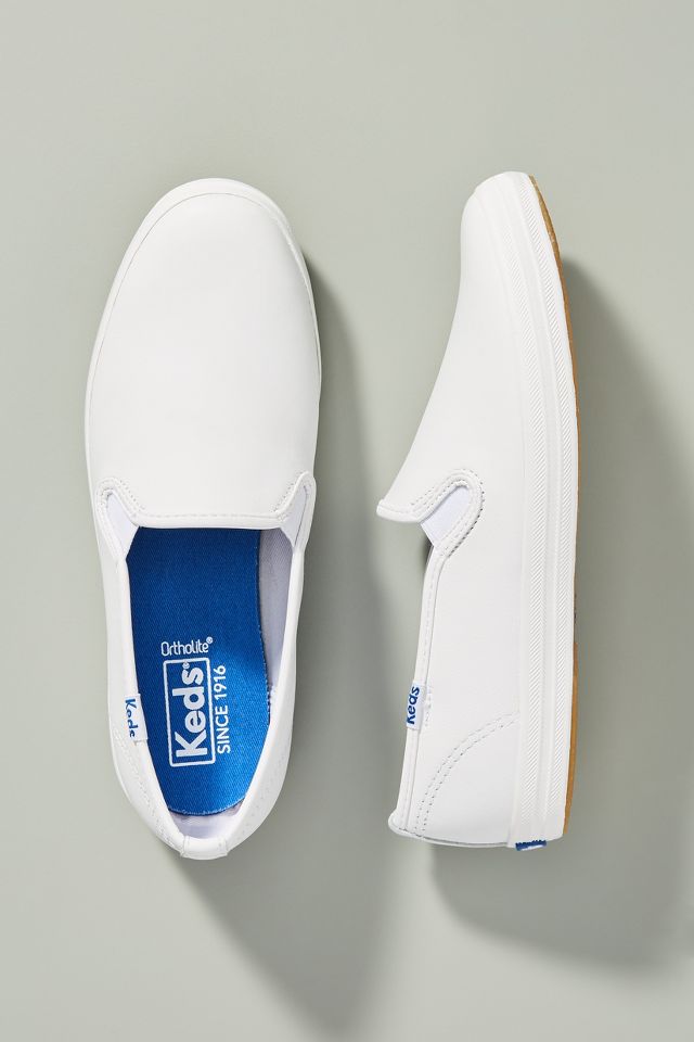 Keds white leather slip best sale on sneakers