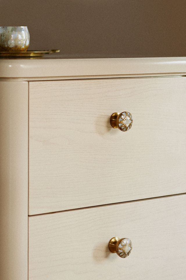 Elegantly crafted Mother of Pearl cabinet knob encased in a brass