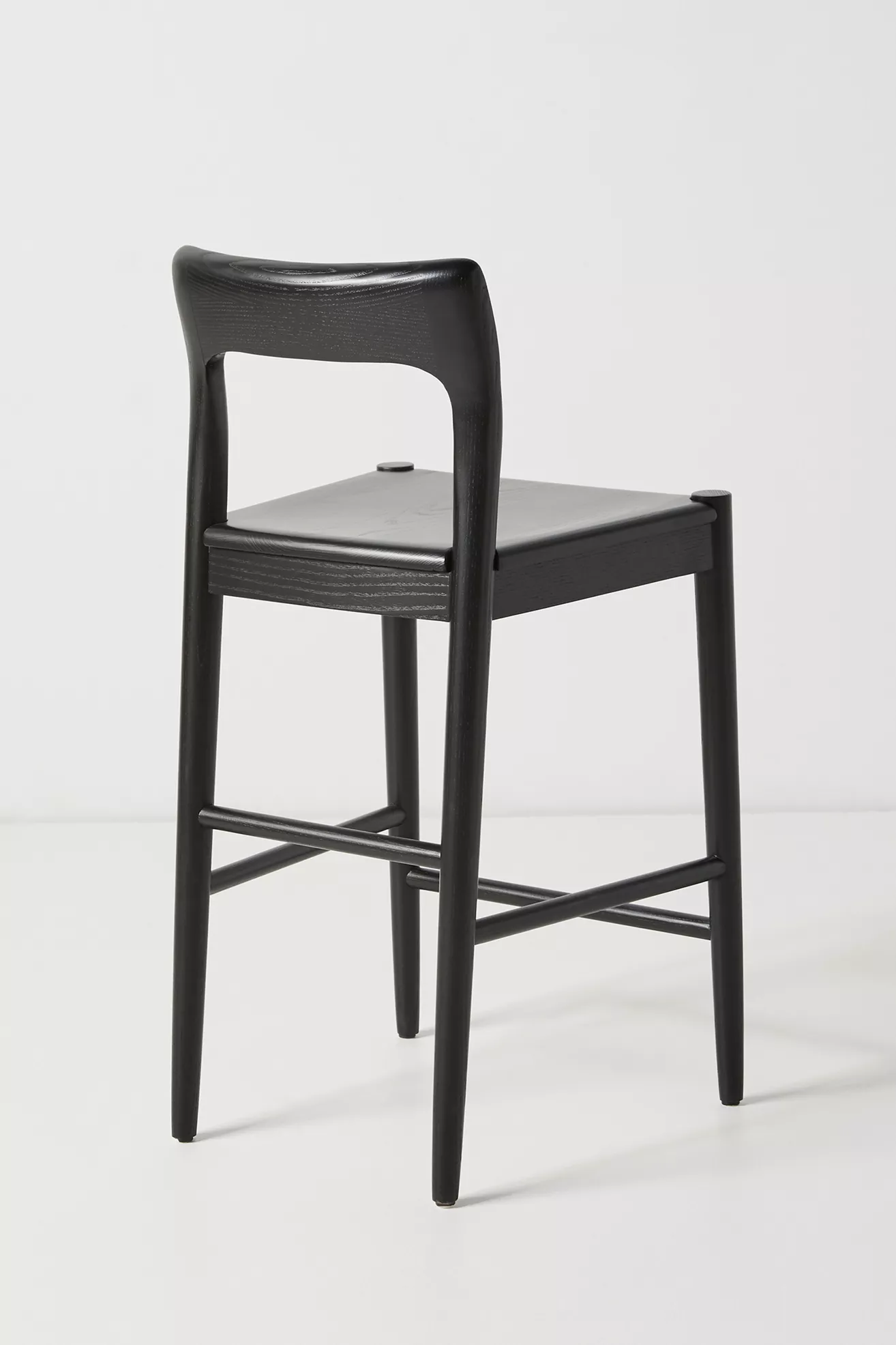 Close-up of the backrest and seat junction on the stool