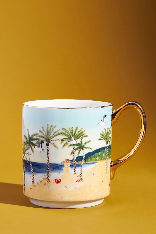 Coffee mug with a snowman on a beach