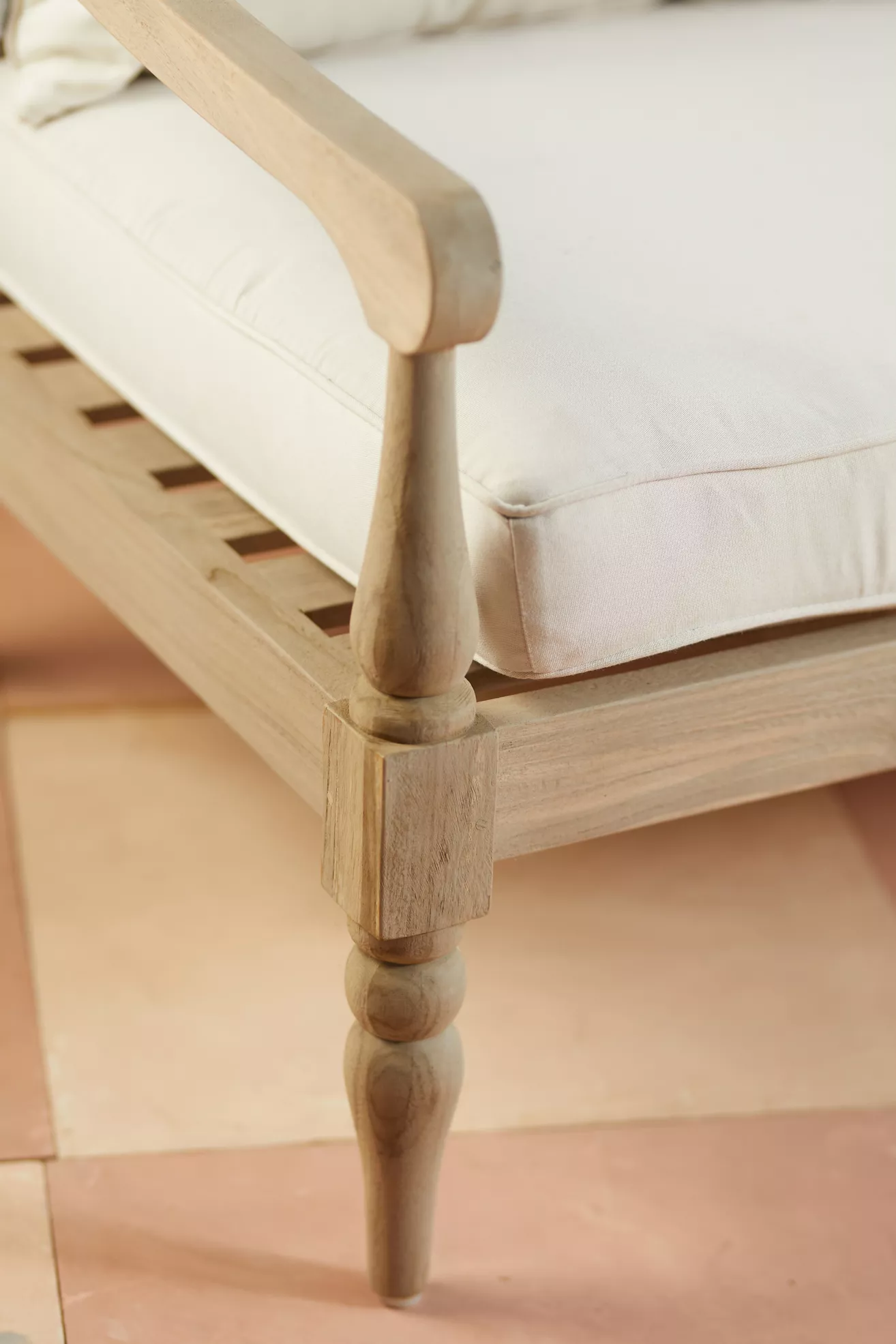 Close-up of teak sofa leg and front corner joinery