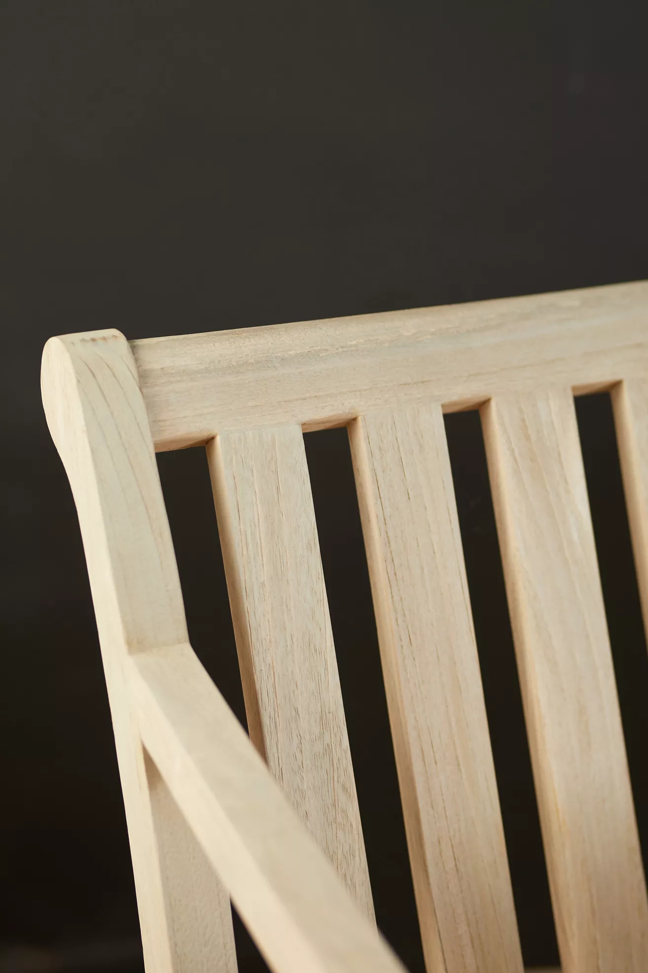 Close-up of light teak sofa slatted back/side panel