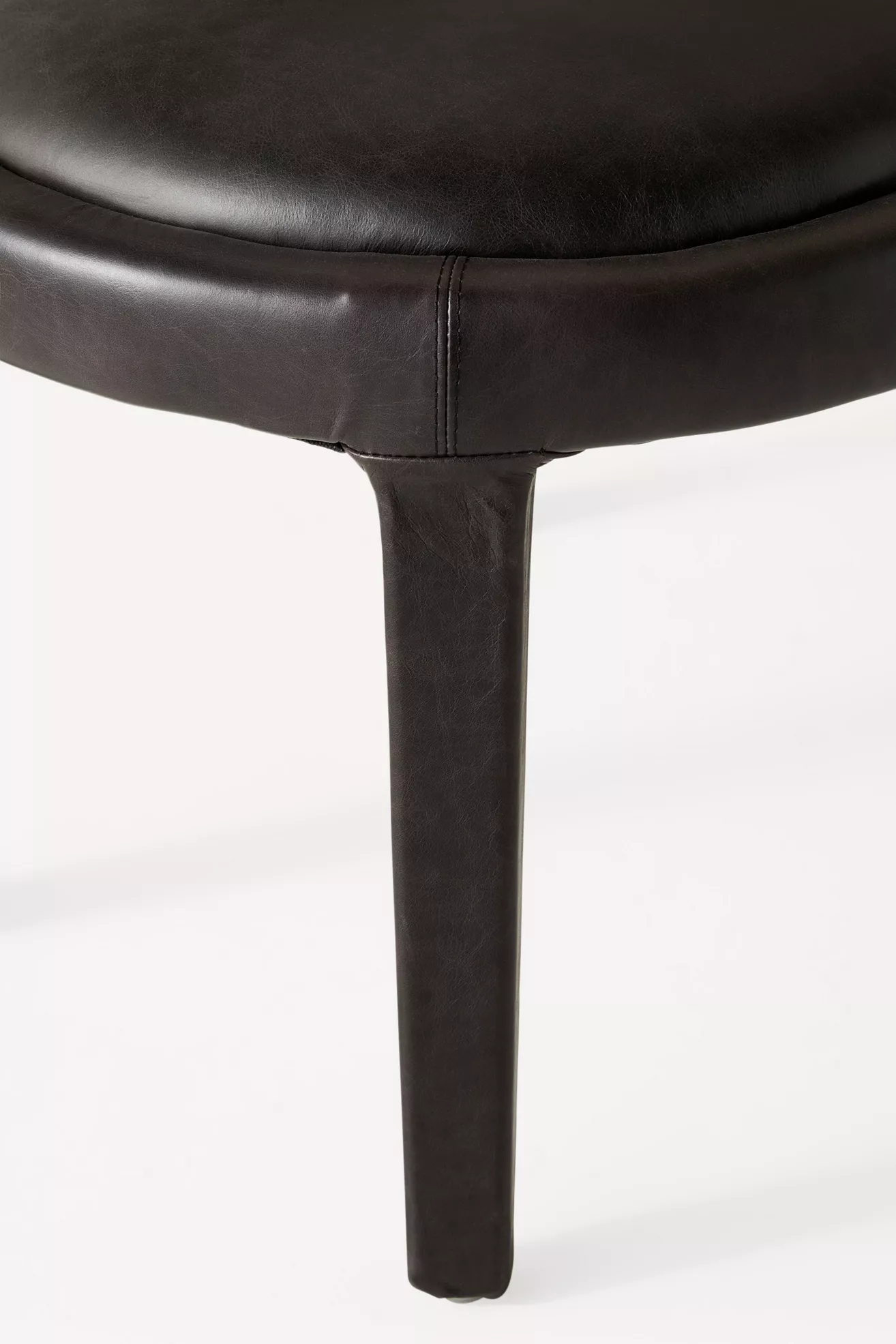 Close-up of chair leg and connection
