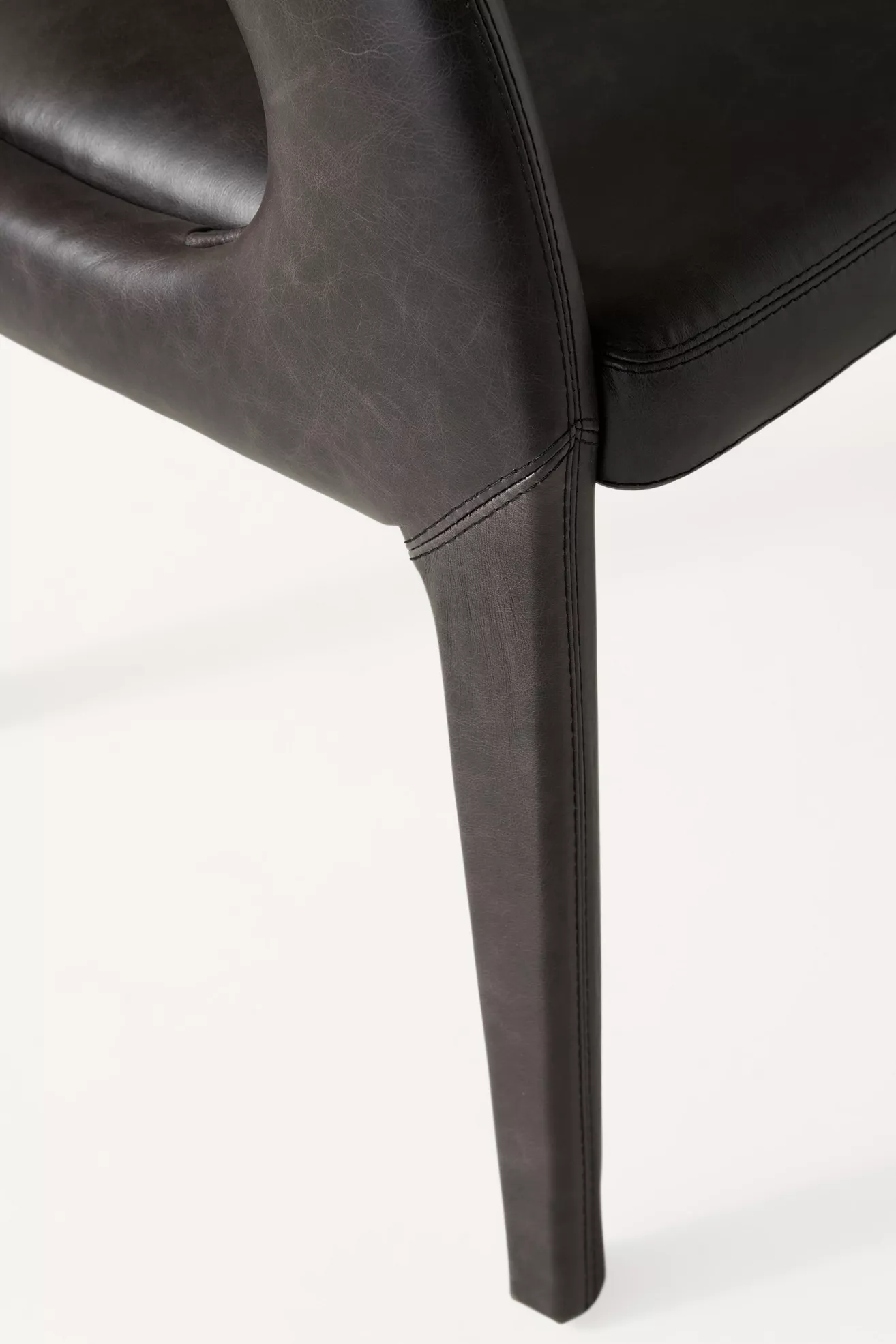 Close-up of chair side with stitching