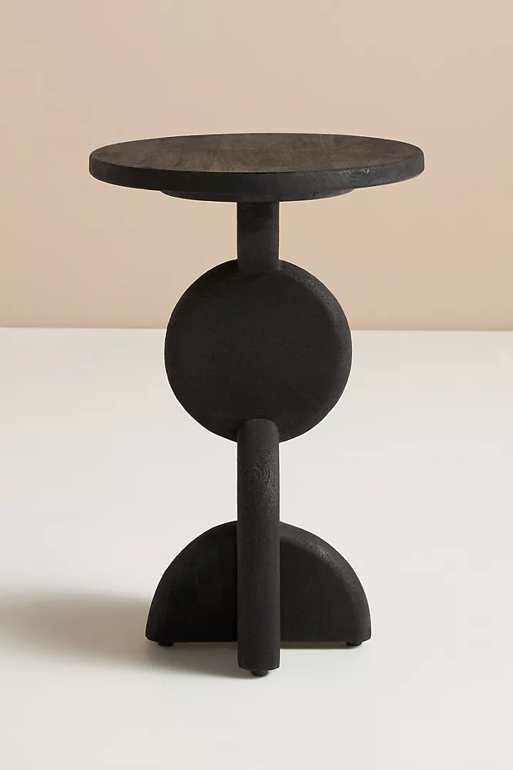 Modern small bedside table with round top and cantilever legs. C-table has cylinder foot -- very unusual!