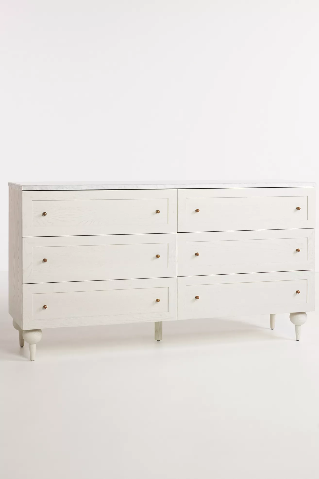 White dresser with six drawers; side angle view