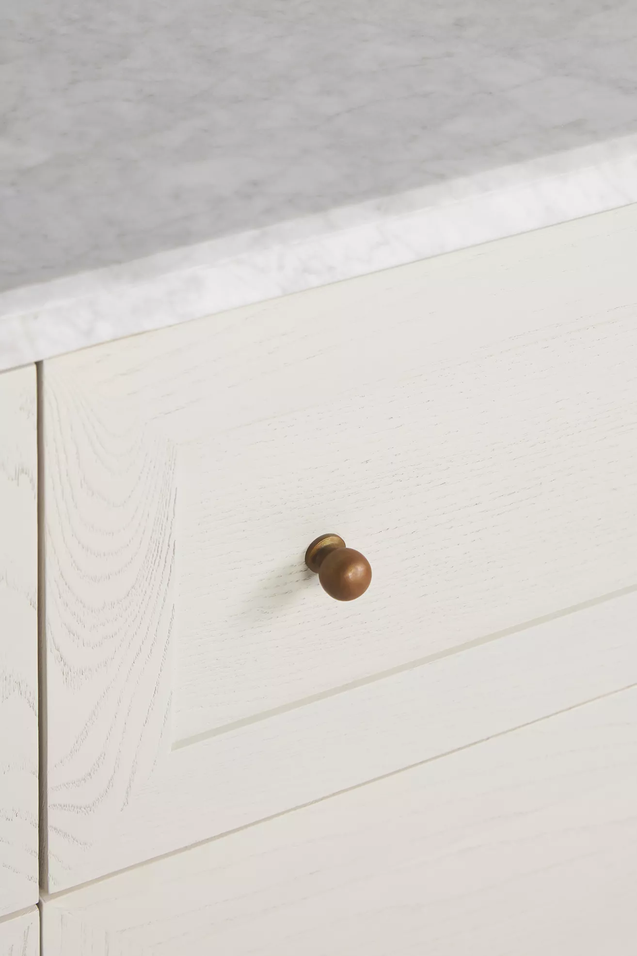 Close-up of marble countertop and knob