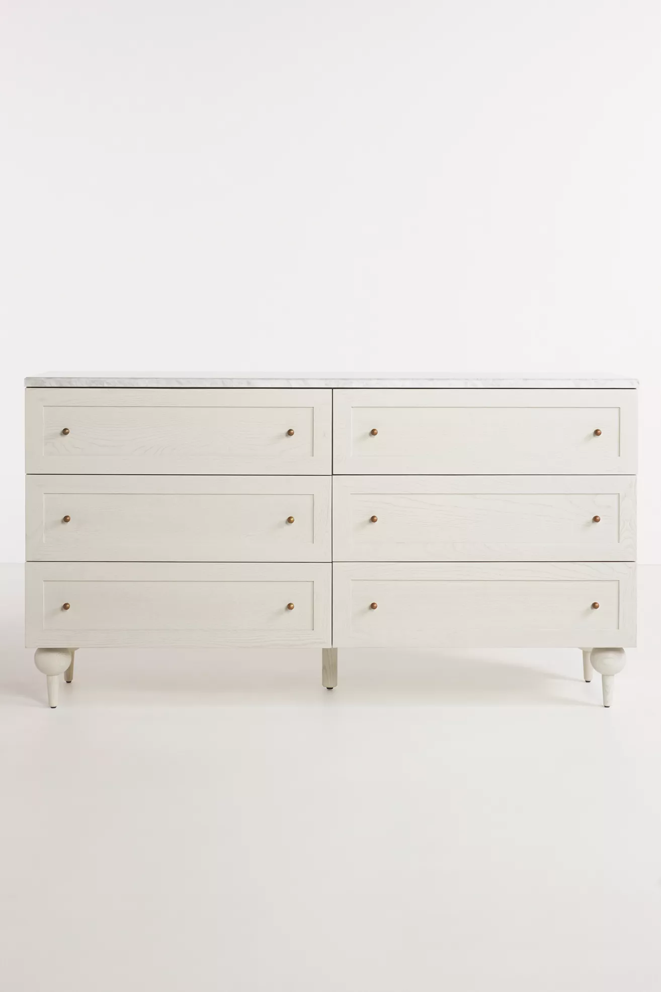 White dresser shown front view with six drawers