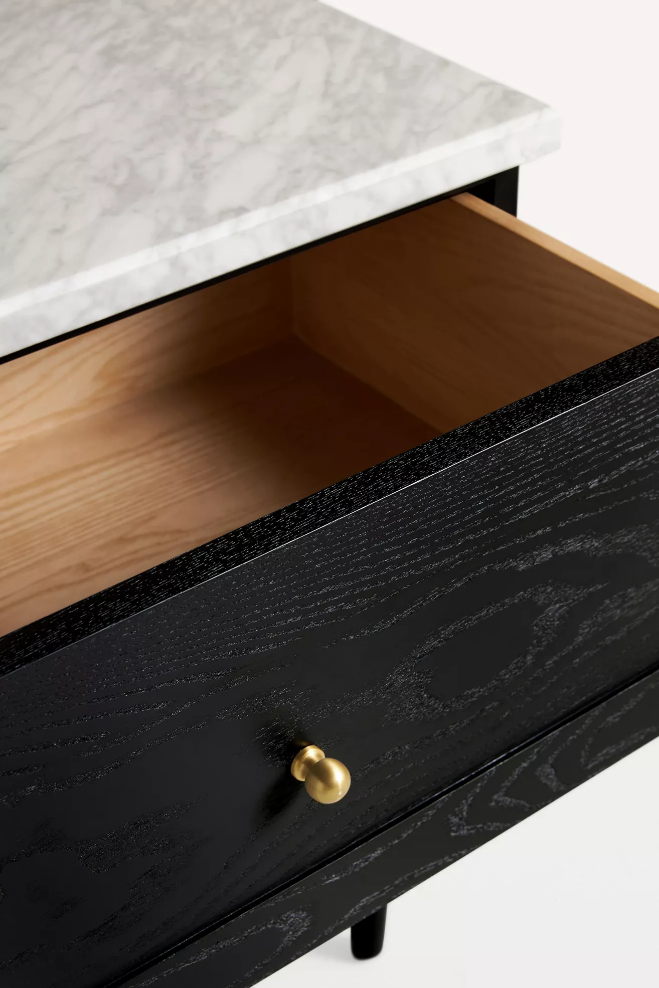 Interior of the top drawer showing wood finish