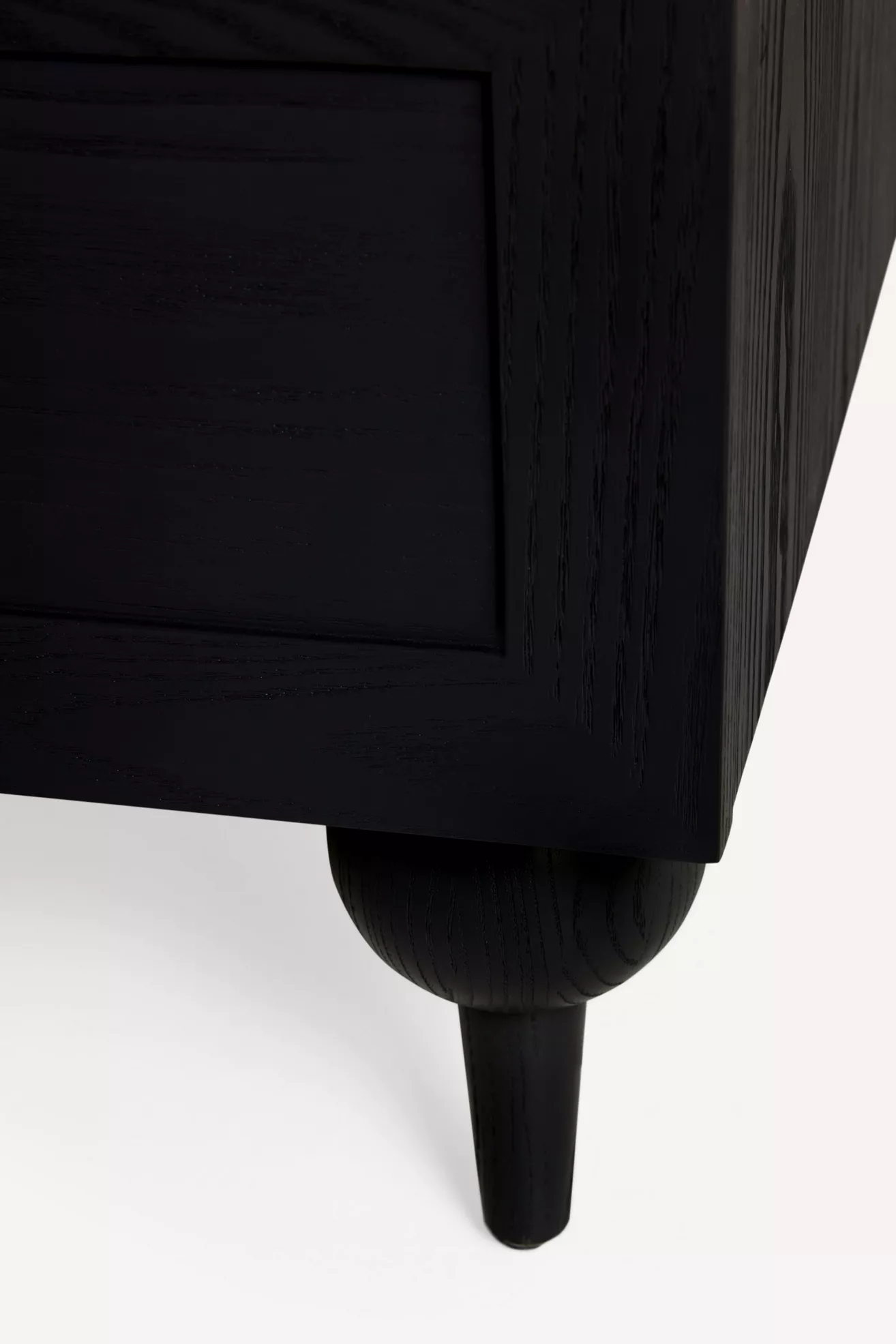 Leg and lower corner of nightstand