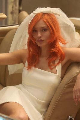 This extreme wedding dress features a hat and a full body veil as