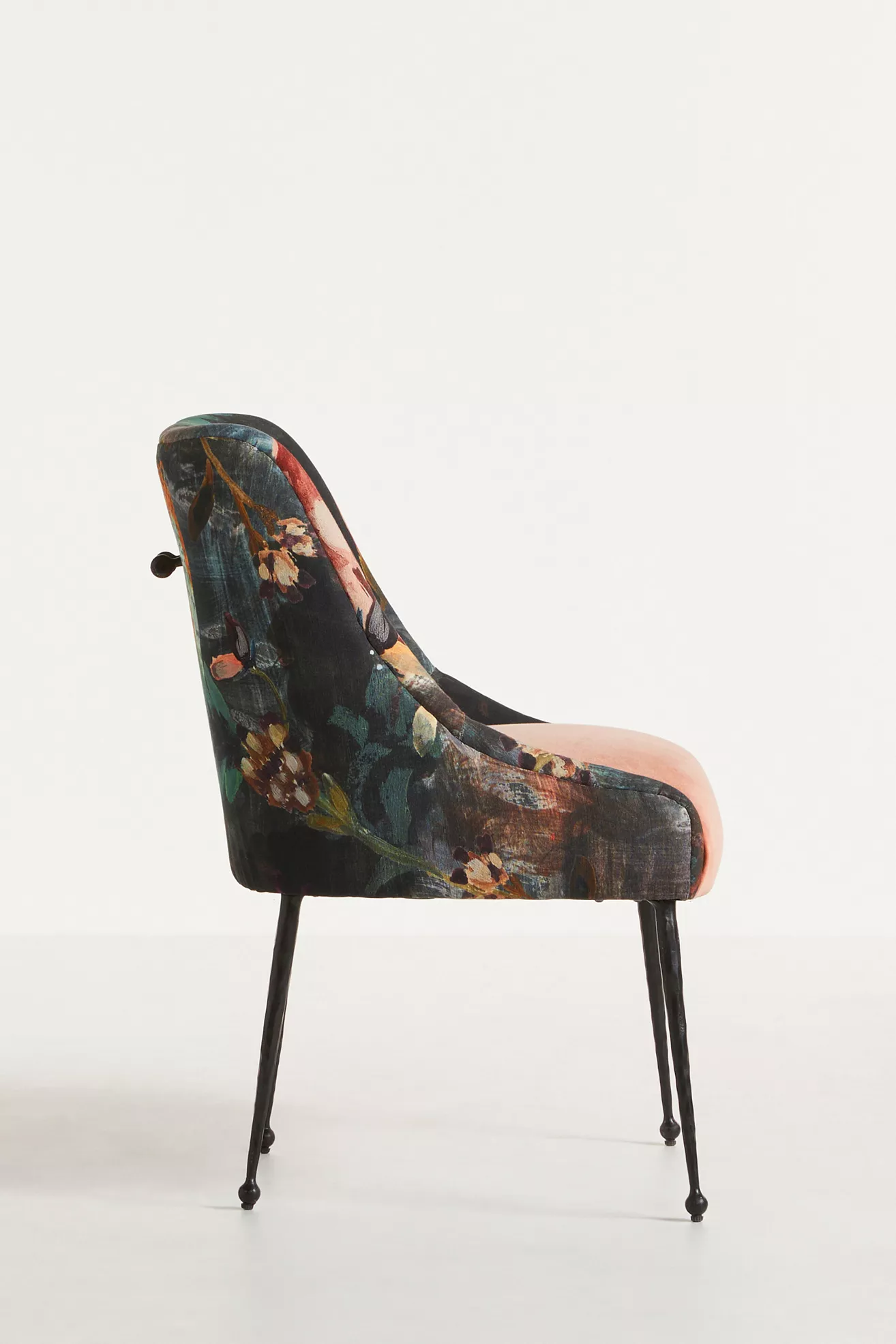 Side view of velvet floral dining chair