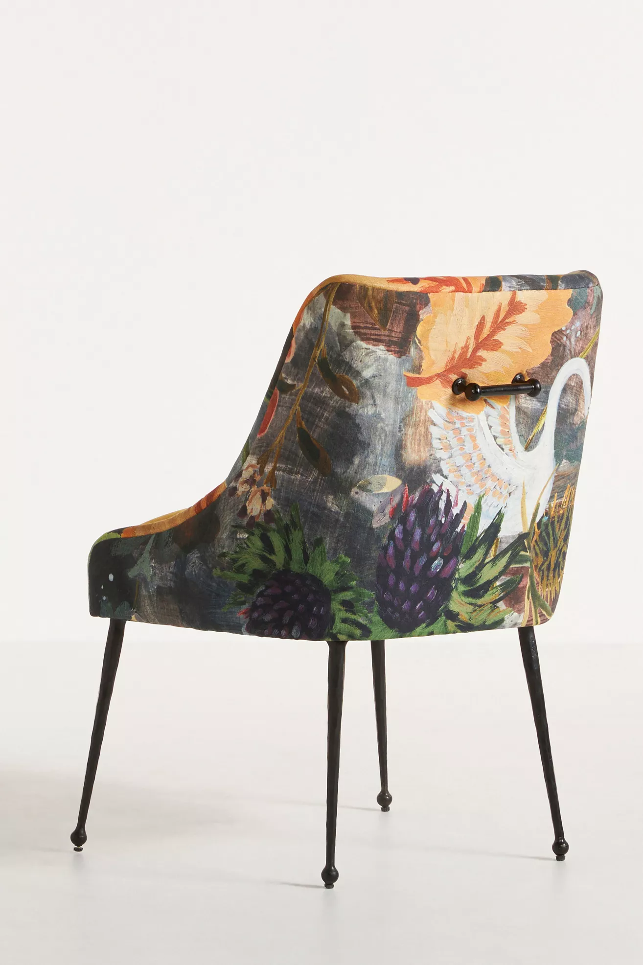 rear/three-quarter view of velvet chair with handles on back
