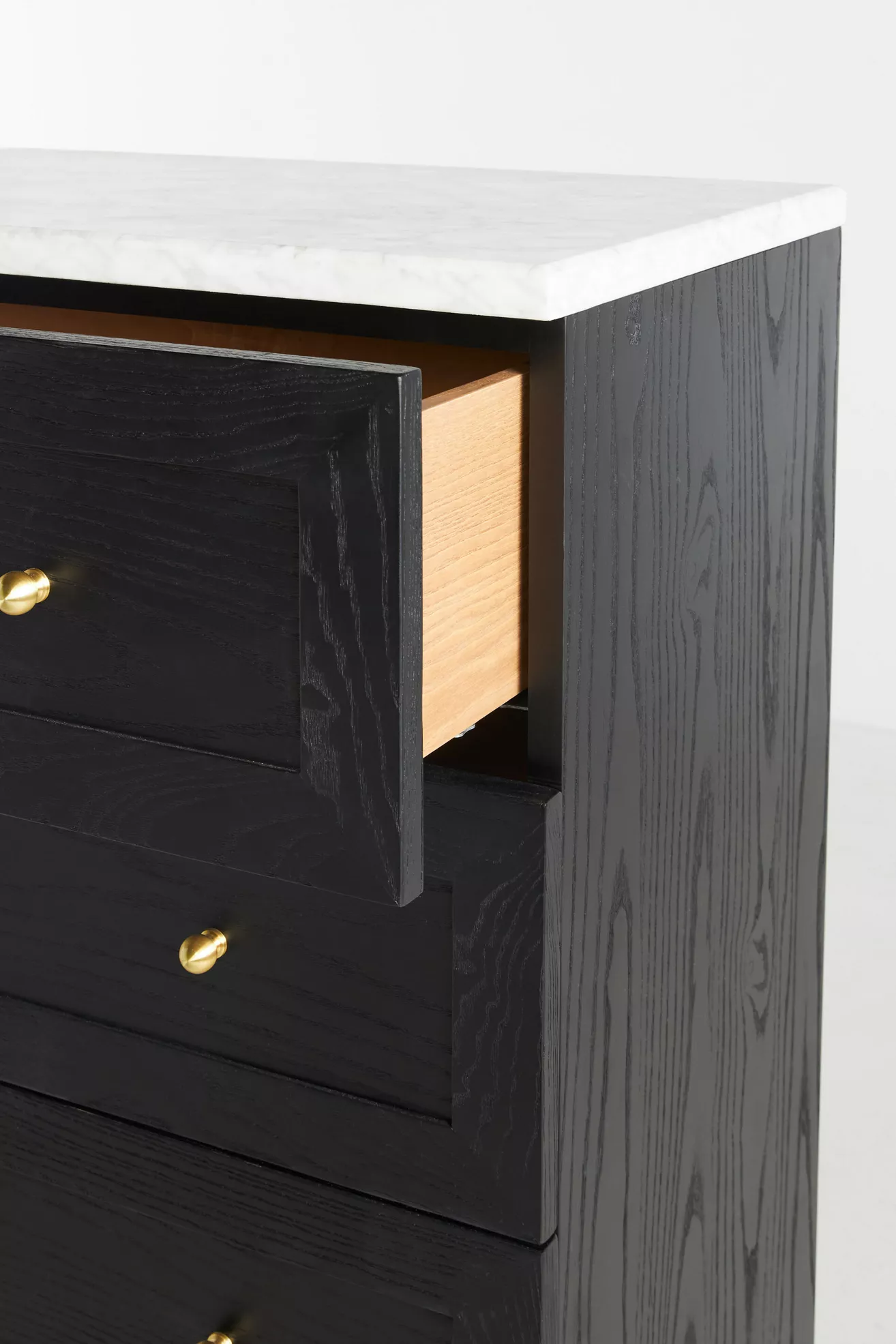 Close-up of side of dresser with marble top